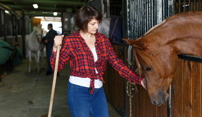 Woman who works at horse stable