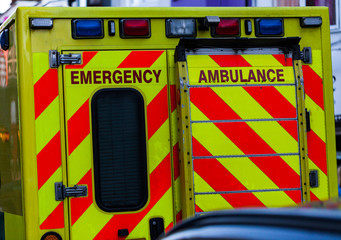 Back view of ambulance car in the traffic. Urgent help and health concept image © Zofia