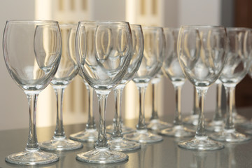 a lot of empty wine glasses on the table, close-up shot