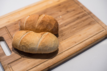 Crunch French bread on a wood cut board.