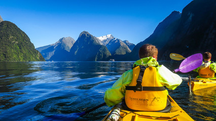 Milford Sound by kayak and boat cruise in New-Zealand - obrazy, fototapety, plakaty