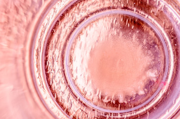 Abstract powdery pink background with concentric circles. Backdrop in pastel colors and space for text.