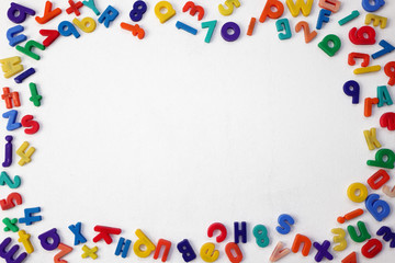 Fototapeta na wymiar Colorful Alphabetical Letters and Numbers on a White Background
