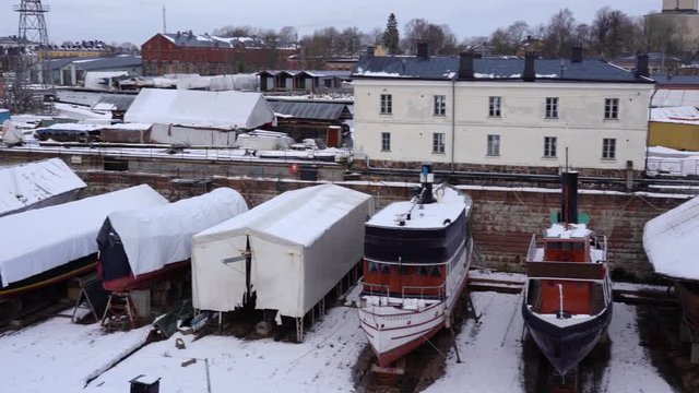 Older ships storage on a dry dock, waiting over the winter for summer. Helsinki Finland