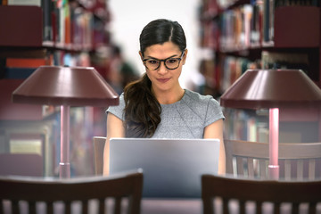 University student, degree in business, law, studying in library, determined to be successful