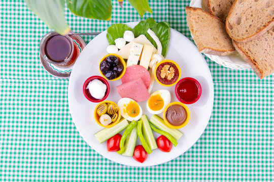 top view turkish breakfast tea and bread on green table - kahvalti tabagi