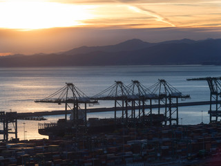 port cranes cargo ship and container  above view at sunset