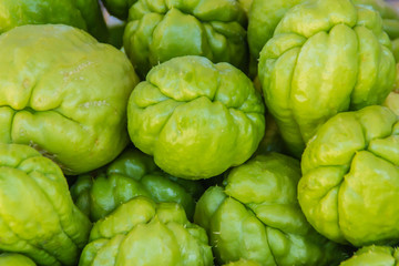 Organic Chayote fruits for sale in the market. Chayote (Sechium edule) is an edible plant that also...