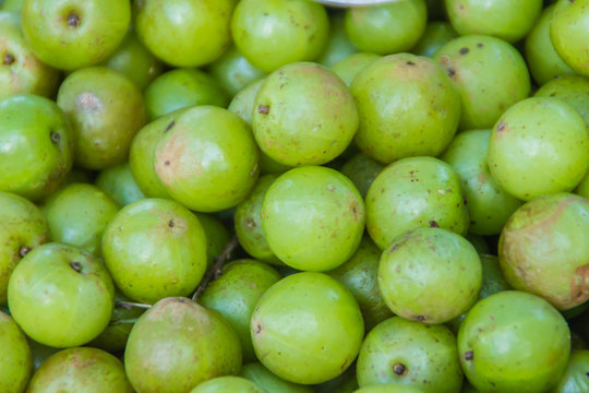 Indian Gooseberry (Phyllanthus Emblica), Also Known As Emblic, Emblic Myrobalan, Myrobalan, Indian Gooseberry, Malacca Tree, Or Amla Fruit. Emblic Fruits For Sale In The Fruit Market, Thailand.