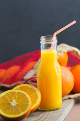 Orange juice served in a small bottle