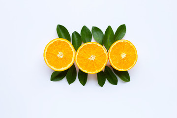 High vitamin C. Fresh orange citrus fruit with leaves isolated on white.