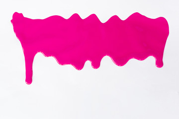 Pink paint dripping  on a white.