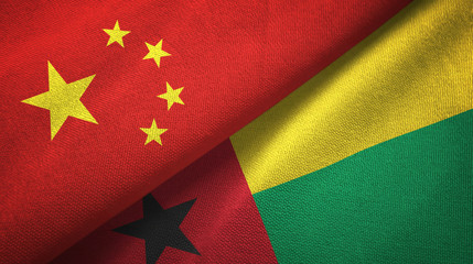 China and Guinea-Bissau two flags textile cloth, fabric texture