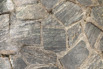 pattern of old irregular stones gives a harmonic background