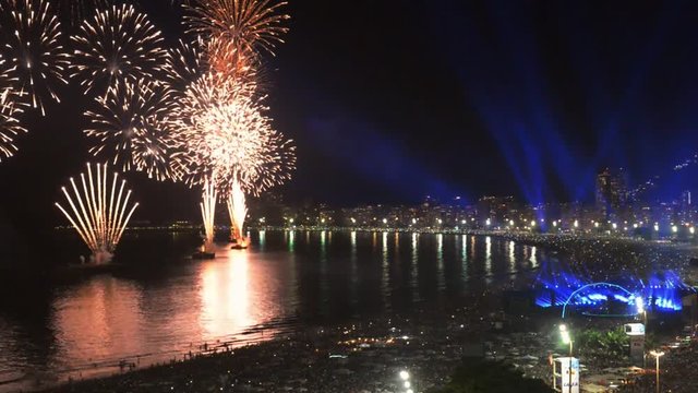 Revelers, both locals and tourist, enjoy the breath-taking New Years fireworks display along Copacabana Beach, Rio de Janeiro, Brazil