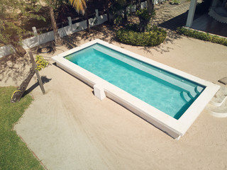 Empty swimming pool with blue water