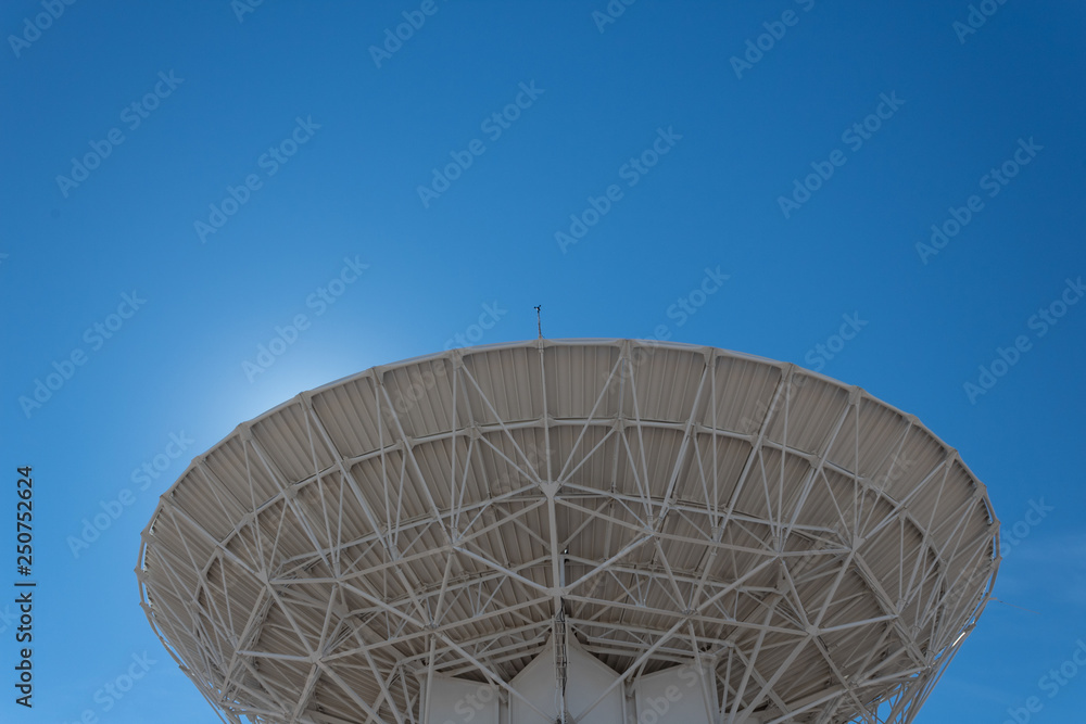 Wall mural very large array backlit radio astronomy observatory dish in clear sky, science technology space, ho