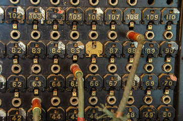 close up of vintage manual telephone switchboard with cable