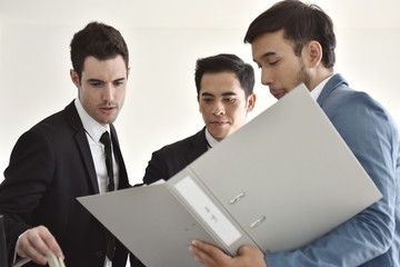 A group of young business people are meeting and having fun. And sometimes stressful