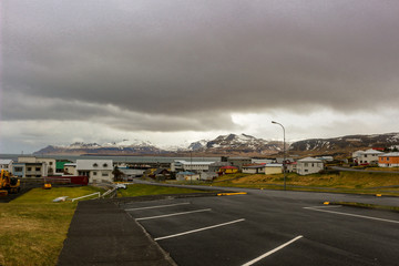 view of olafsvik iceland from upper hill that shows the mountains in the distance