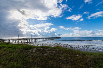 Fototapeta premium Pier over the ocean with sea grasses