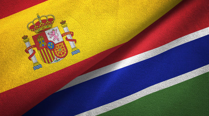 Spain and Gambia two flags textile cloth, fabric texture