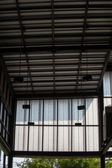 Aluminum Metal corrugated roof sheets and black steel column structure.