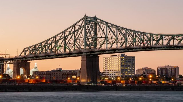 Sunset to night timelapse of the Montreal city skyline, Belvedere Jacques Cartier Bridge with St Lawrence river