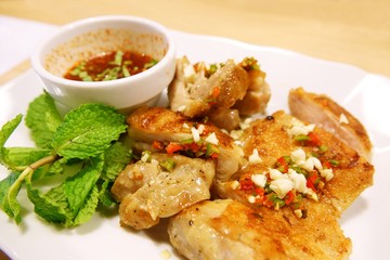 grilled chicken on plate and Spicy sauce, style thai food