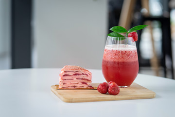 Strawberry fruit tea with a slice of strawberry cake