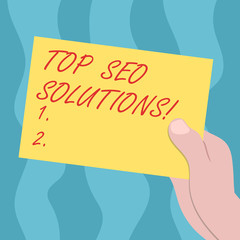 Conceptual hand writing showing Top Seo Solutions. Business photo text methodology of techniques to increase amount of visitors Drawn Hu analysis Hand Holding Blank Color Paper Cardboard