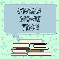 Fototapeta premium Handwriting text writing Cinema Movie Time. Concept meaning which entertainment such showing movie scheduled to start Uneven Pile of Hardbound Books and Blank Rectangular Color Speech Bubble