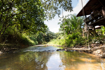Fototapeta na wymiar Swings along the stream of waterfalls in Thailand