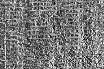 gray crumpled aluminum foil with square structure