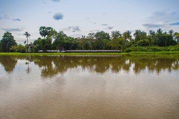 Obraz na płótnie Canvas Blue sky and white clouds of the countryside scenery along Tha Chin river(Maenam Tha Chin), Nakhon Pathom,Thailand