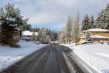 Suburban Neighborhood Street De-Icing on Winter Snow Day