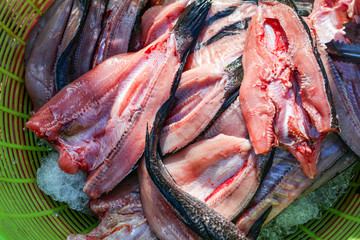 fresh raw striped snakehead fish dissect for dry in basket
