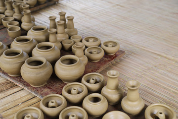 Closeup of fresh earthenware, pottery drying indoor. The classical and unique handmade product of Thailand.