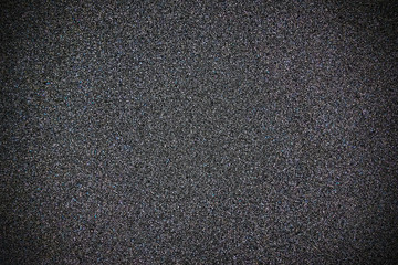 Background in the form of honeycomb structure of black color. Close-up sponge.