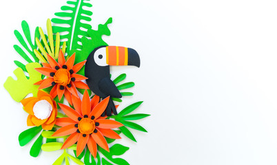 Decorative Arrangement of tropical leaves and flowers. Toucan bird made of paper. © Дарья Колпакова