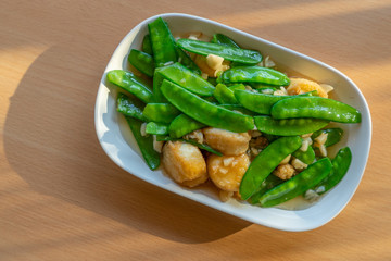 Stir fried green peas with soft egg tofu