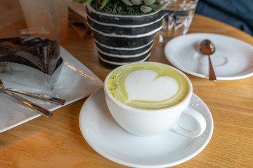 cup of green tea with decoration