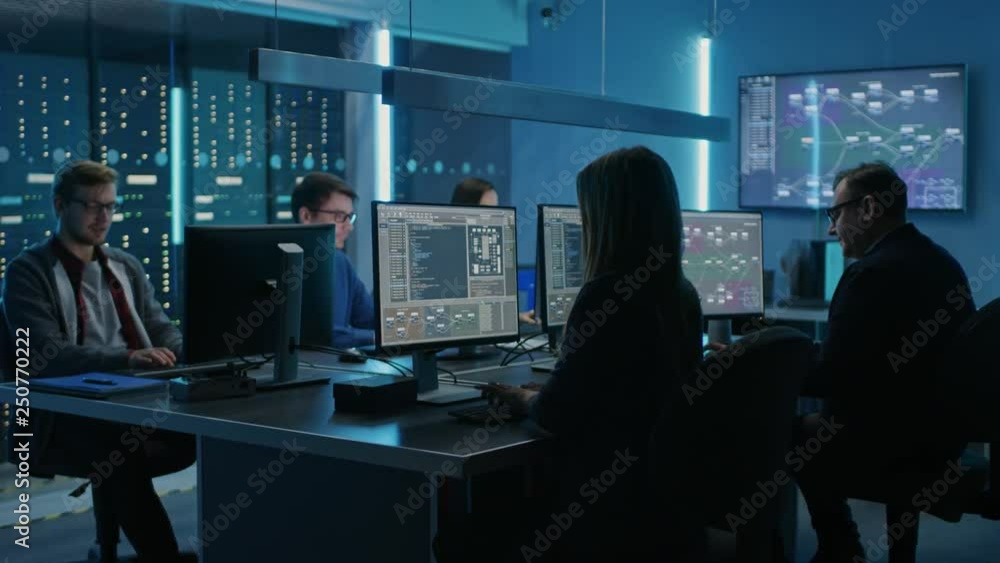 Poster Team of Young IT Programers Working on Desktop Computers in Data Center System Control Room. Displays Show Concept: Software Development / Code Writing / Database Architecture. Technical Department