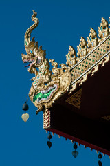 Fototapeta na wymiar Chiang Rai Thailand, carved mystical serpent roof finials at Wat Sri Bun Rueang