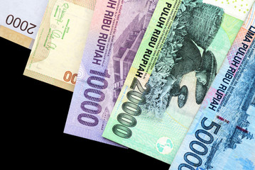 Indonesian rupiah on dark background close up