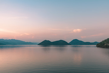 Fototapeta premium Scenery after sunset of Kwai Yai river at Srinagarind Dam in Kanchanaburi, Thailand