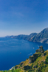 Fototapeta na wymiar Mountains and coastline of Amalfi Coast from Path of the Gods, a hiking trail near Positano, Italy