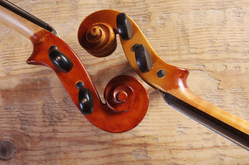 Two fingerboards of violins on a wooden table