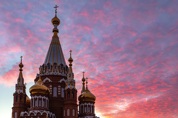 Church on the background of a beautiful sunset. Easter holiday for Christians