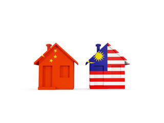Two houses with flags of China and malaysia
